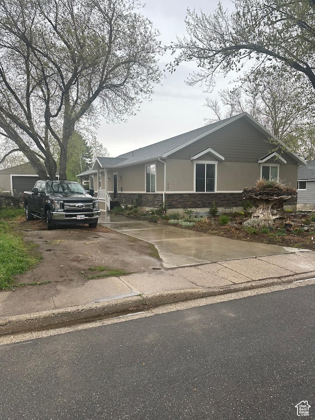 210 S 350 W, Bountiful, UT 84010 - view of front of home with stucco siding, driveway, and stone siding