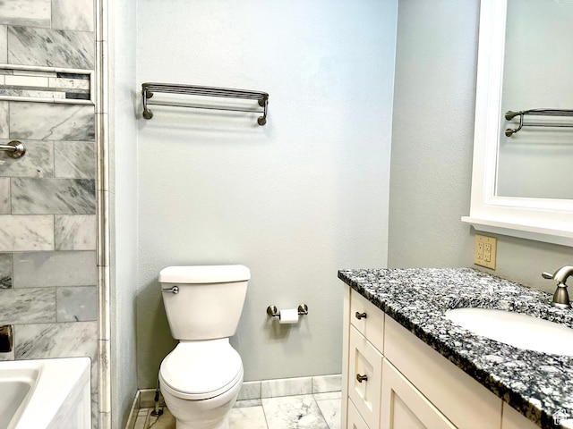 bathroom with vanity, baseboards, marble finish floors, and toilet