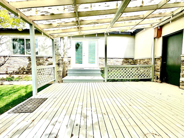 wooden terrace with french doors and a pergola