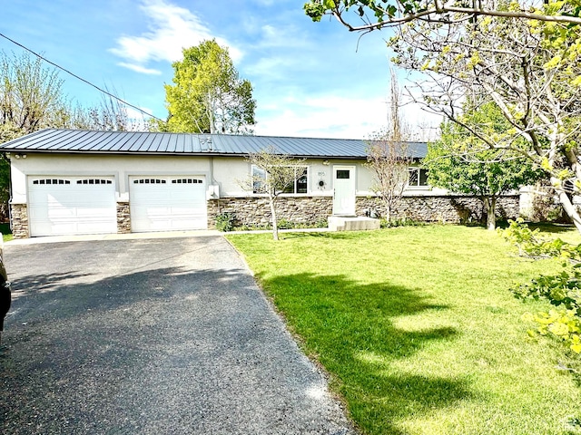 ranch-style house featuring stucco siding, stone siding, asphalt driveway, and a front lawn