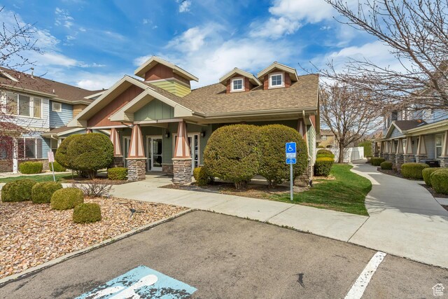 24 S 1520 W, Pleasant Grove, UT 84062 - craftsman inspired home featuring a shingled roof, stone siding, and covered porch