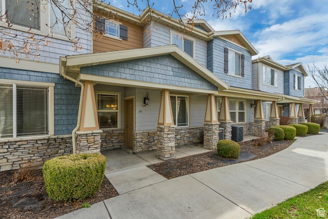 24 S 1520 W, Pleasant Grove, UT 84062 - view of front facade featuring a porch, stone siding, and central AC unit