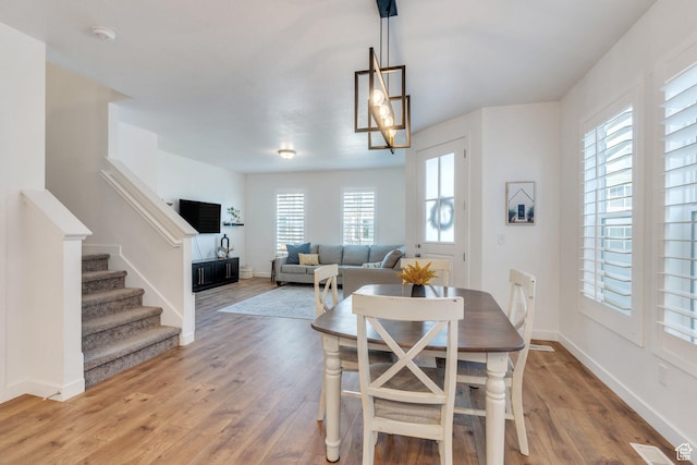 4434 W Glendon Dr, Lehi, UT 84043 - dining space featuring stairway, visible vents, light wood-style flooring, and baseboards