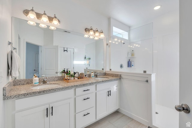 4434 W Glendon Dr, Lehi, UT 84043 - bathroom featuring double vanity, a sink, a walk in shower, and visible vents
