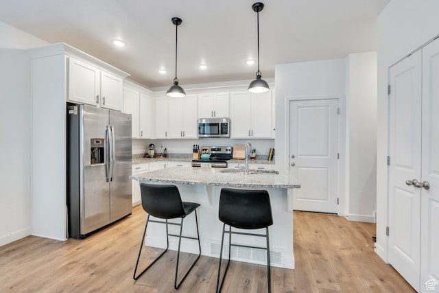 4434 W Glendon Dr, Lehi, UT 84043 - kitchen with white cabinets, stainless steel appliances, light wood-style floors, and a sink
