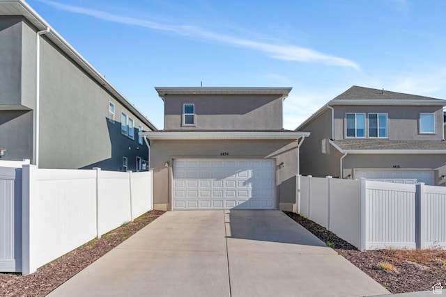 4434 W Glendon Dr, Lehi, UT 84043 - exterior space with driveway, a garage, stucco siding, and fence
