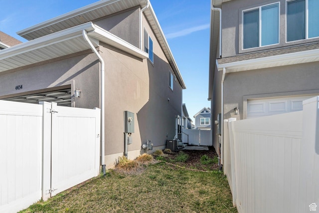 4434 W Glendon Dr, Lehi, UT 84043 - view of side of property featuring fence, central air condition unit, and stucco siding