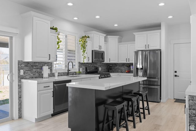 4634 W Baldy Dr, West Jordan, UT 84088 - kitchen featuring stainless steel fridge, recessed lighting, white cabinets, and gas stove