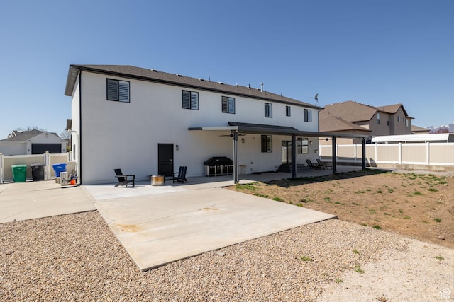4634 W Baldy Dr, West Jordan, UT 84088 - rear view of property featuring a patio, a fenced backyard, and stucco siding