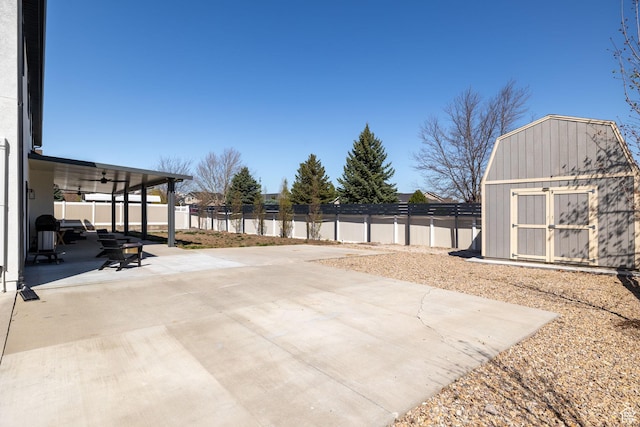 4634 W Baldy Dr, West Jordan, UT 84088 - view of patio / terrace featuring a storage unit, a fenced backyard, ceiling fan, and an outdoor structure