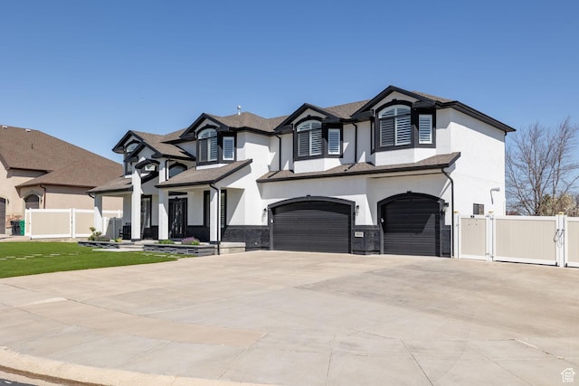 4634 W Baldy Dr, West Jordan, UT 84088 - french country home with an attached garage, fence, driveway, and stucco siding