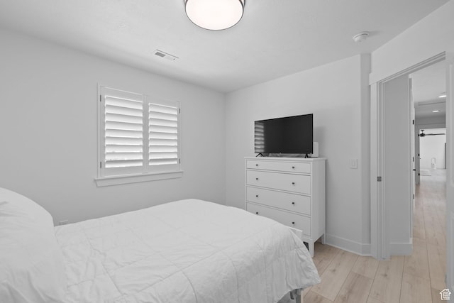 4634 W Baldy Dr, West Jordan, UT 84088 - bedroom with light wood-type flooring, baseboards, and visible vents