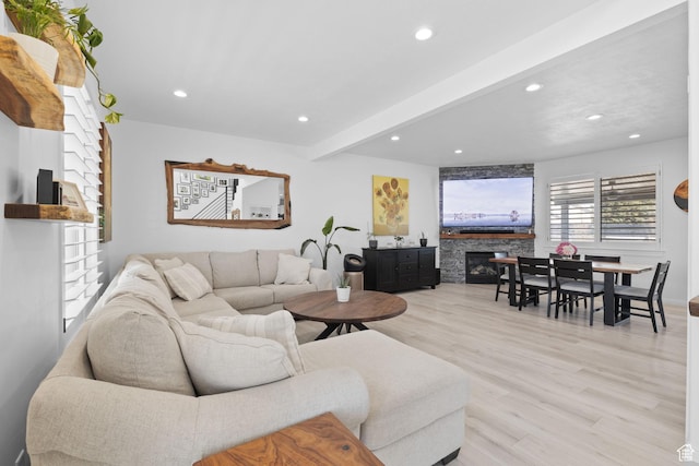 4634 W Baldy Dr, West Jordan, UT 84088 - living room featuring recessed lighting, beamed ceiling, a stone fireplace, and wood finished floors