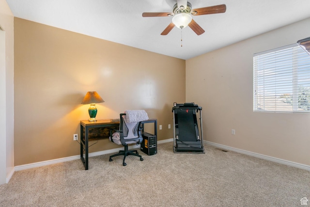 office space featuring visible vents, baseboards, a ceiling fan, and carpet floors
