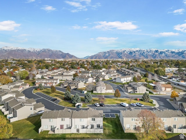 birds eye view of property featuring a mountain view and a residential view