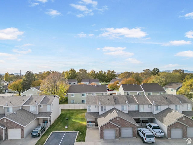 birds eye view of property with a residential view