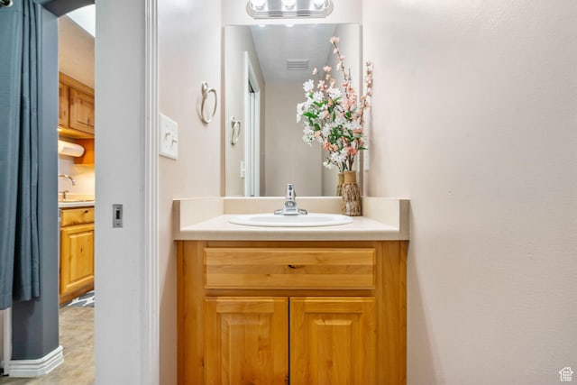 bathroom with visible vents and vanity