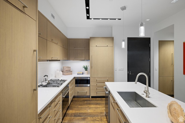 333 Main St Unit 23, Park City, UT 84060 - kitchen featuring dark wood-style floors, light countertops, a sink, and appliances with stainless steel finishes