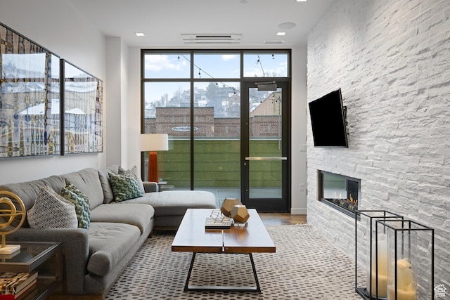 333 Main St Unit 23, Park City, UT 84060 - living room with a wall of windows, wood finished floors, and a fireplace
