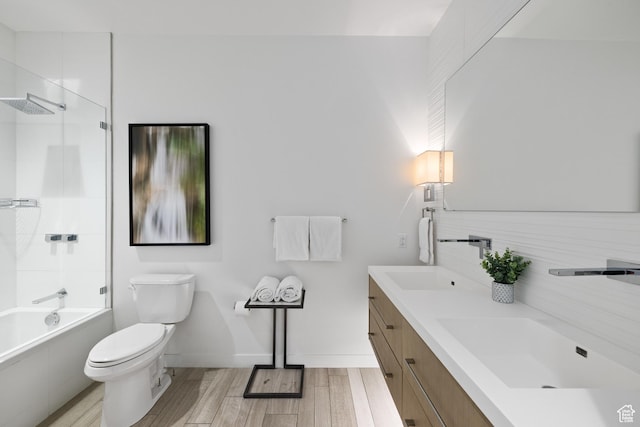 333 Main St Unit 23, Park City, UT 84060 - bathroom featuring toilet, tasteful backsplash, wood finished floors, and a sink