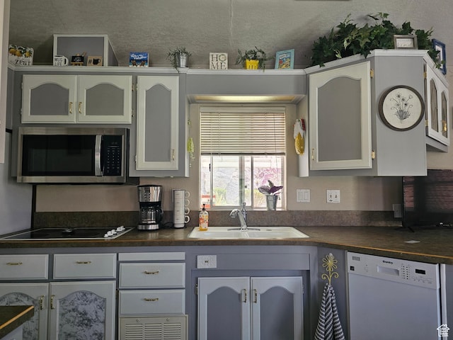 16 Mountain Vw, Hurricane, UT 84737 - kitchen featuring stainless steel microwave, a sink, white dishwasher, and dark countertops