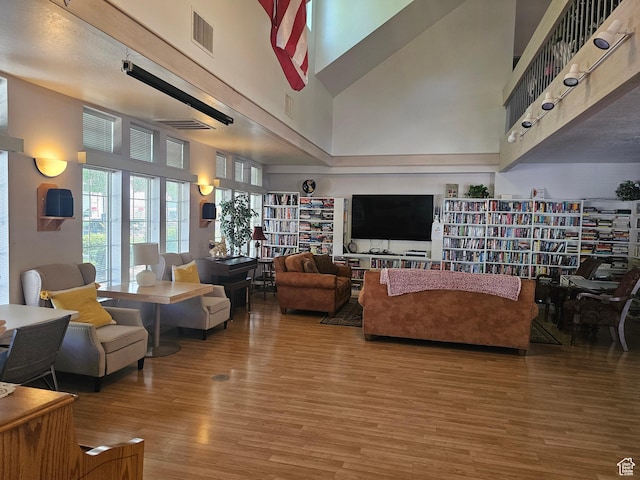 16 Mountain Vw, Hurricane, UT 84737 - living area with a towering ceiling, visible vents, and wood finished floors