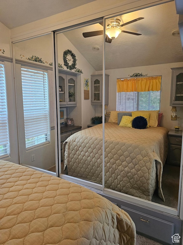 16 Mountain Vw, Hurricane, UT 84737 - bedroom with a closet, ceiling fan, multiple windows, and vaulted ceiling