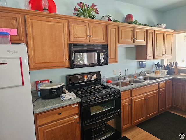 16 Mountain Vw, Hurricane, UT 84737 - kitchen featuring light countertops, light wood-style floors, a sink, and black appliances