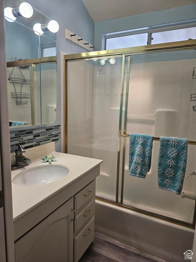 16 Mountain Vw, Hurricane, UT 84737 - bathroom featuring tasteful backsplash, vanity, wood finished floors, and bath / shower combo with glass door