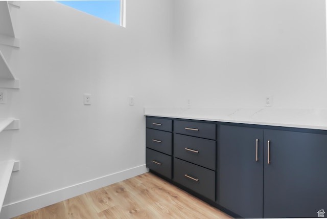 4125 N Maple Blvd W Unit 119, Lehi, UT 84043 - bathroom featuring wood finished floors, baseboards, and vanity