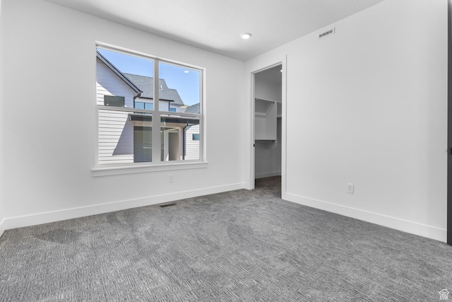 4125 N Maple Blvd W Unit 119, Lehi, UT 84043 - unfurnished bedroom featuring baseboards, carpet floors, and a spacious closet
