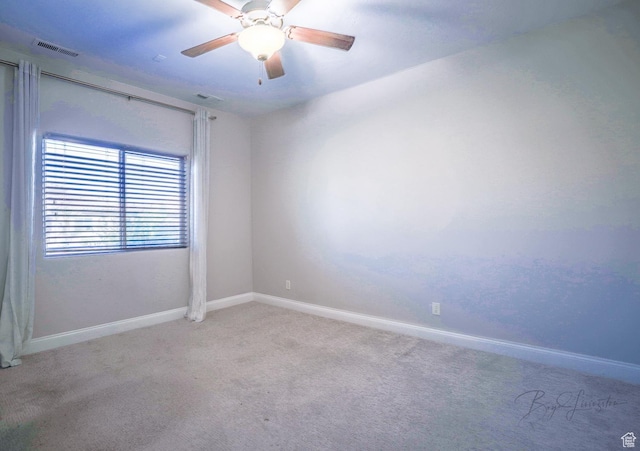 spare room featuring visible vents, ceiling fan, carpet flooring, and baseboards