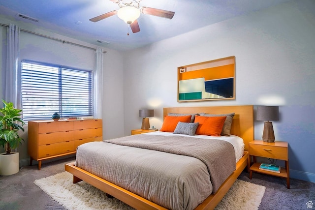 bedroom with visible vents, baseboards, a ceiling fan, and carpet flooring