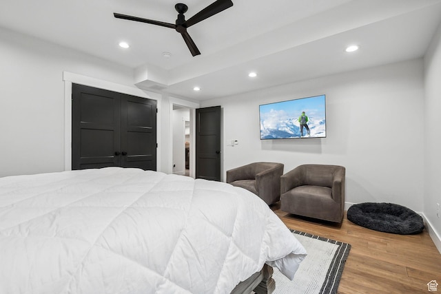 bedroom with recessed lighting, ceiling fan, baseboards, and wood finished floors