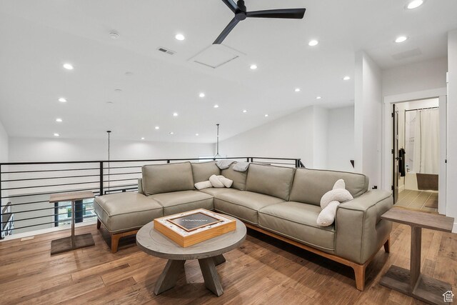living room with wood finished floors, ceiling fan, visible vents, and recessed lighting