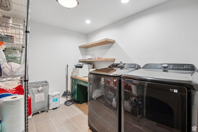 laundry area featuring recessed lighting, light tile patterned floors, washer and clothes dryer, and laundry area