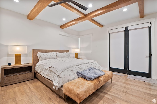 bedroom with light wood-style floors, baseboards, beam ceiling, and recessed lighting