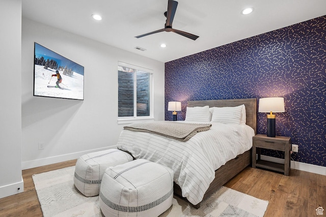 bedroom featuring wallpapered walls, baseboards, visible vents, and recessed lighting