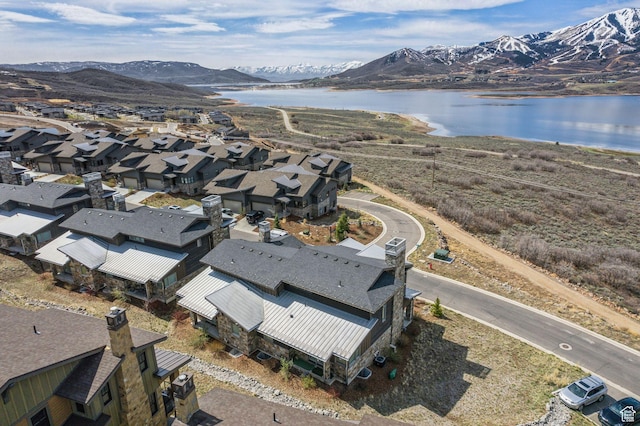 bird's eye view featuring a water and mountain view and a residential view