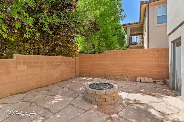 view of patio / terrace featuring a fire pit and a fenced backyard