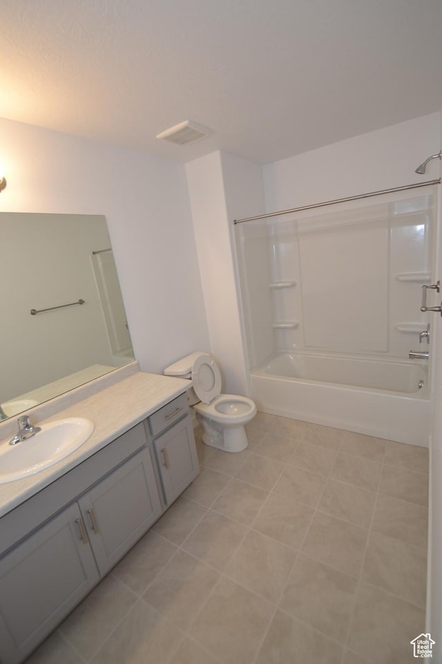 bathroom featuring toilet, vanity, shower / tub combination, and visible vents