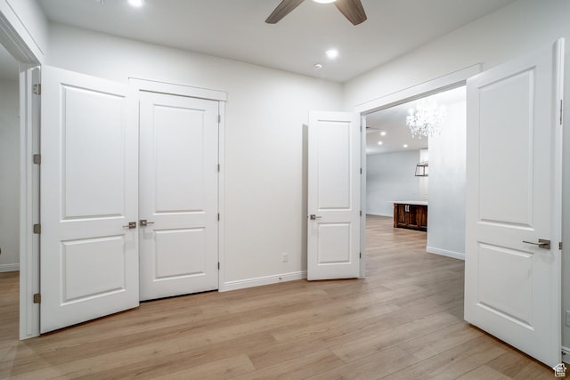 2889 E 1400 S, St George, UT 84790 - unfurnished bedroom with light wood-style flooring, a closet, baseboards, and recessed lighting