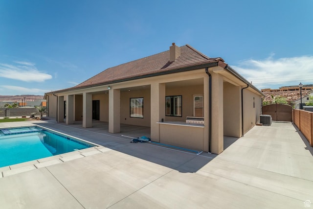 2889 E 1400 S, St George, UT 84790 - rear view of property featuring a fenced in pool, stucco siding, a patio area, central AC, and a gate