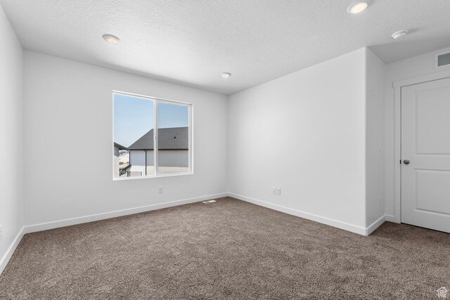 1748 S Windy Ridge Dr Unit 1281, Spanish Fork, UT 84660 - carpeted spare room with visible vents, baseboards, and a textured ceiling