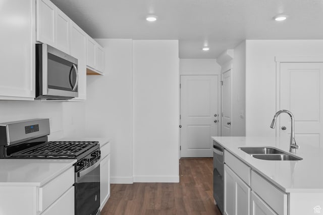 1748 S Windy Ridge Dr Unit 1281, Spanish Fork, UT 84660 - kitchen featuring dark wood-type flooring, appliances with stainless steel finishes, a sink, and light countertops