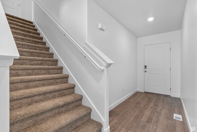 1748 S Windy Ridge Dr Unit 1281, Spanish Fork, UT 84660 - entrance foyer with visible vents, recessed lighting, wood finished floors, stairs, and baseboards