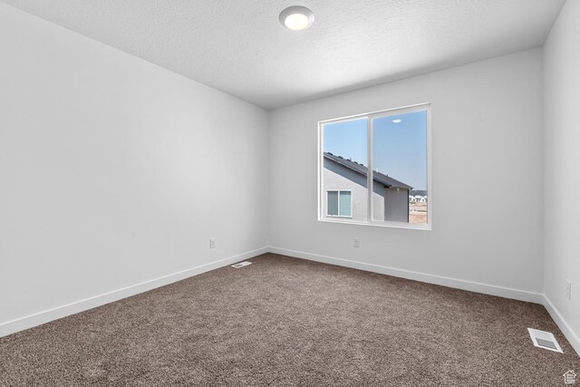 1748 S Windy Ridge Dr Unit 1281, Spanish Fork, UT 84660 - empty room featuring dark carpet, visible vents, baseboards, and a textured ceiling