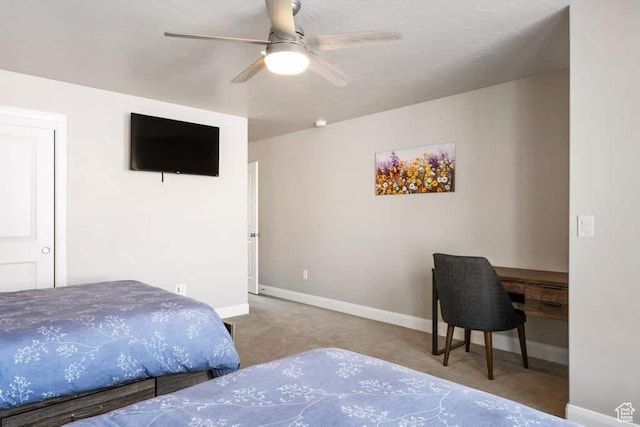 bedroom featuring baseboards, a ceiling fan, and carpet floors
