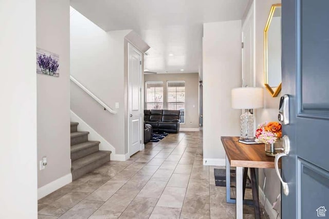 entrance foyer featuring baseboards, stairway, marble finish floor, and recessed lighting