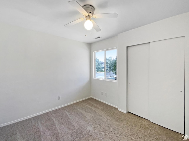 6647 W Merlot Way, West Jordan, UT 84081 - unfurnished bedroom featuring visible vents, baseboards, a closet, ceiling fan, and light colored carpet